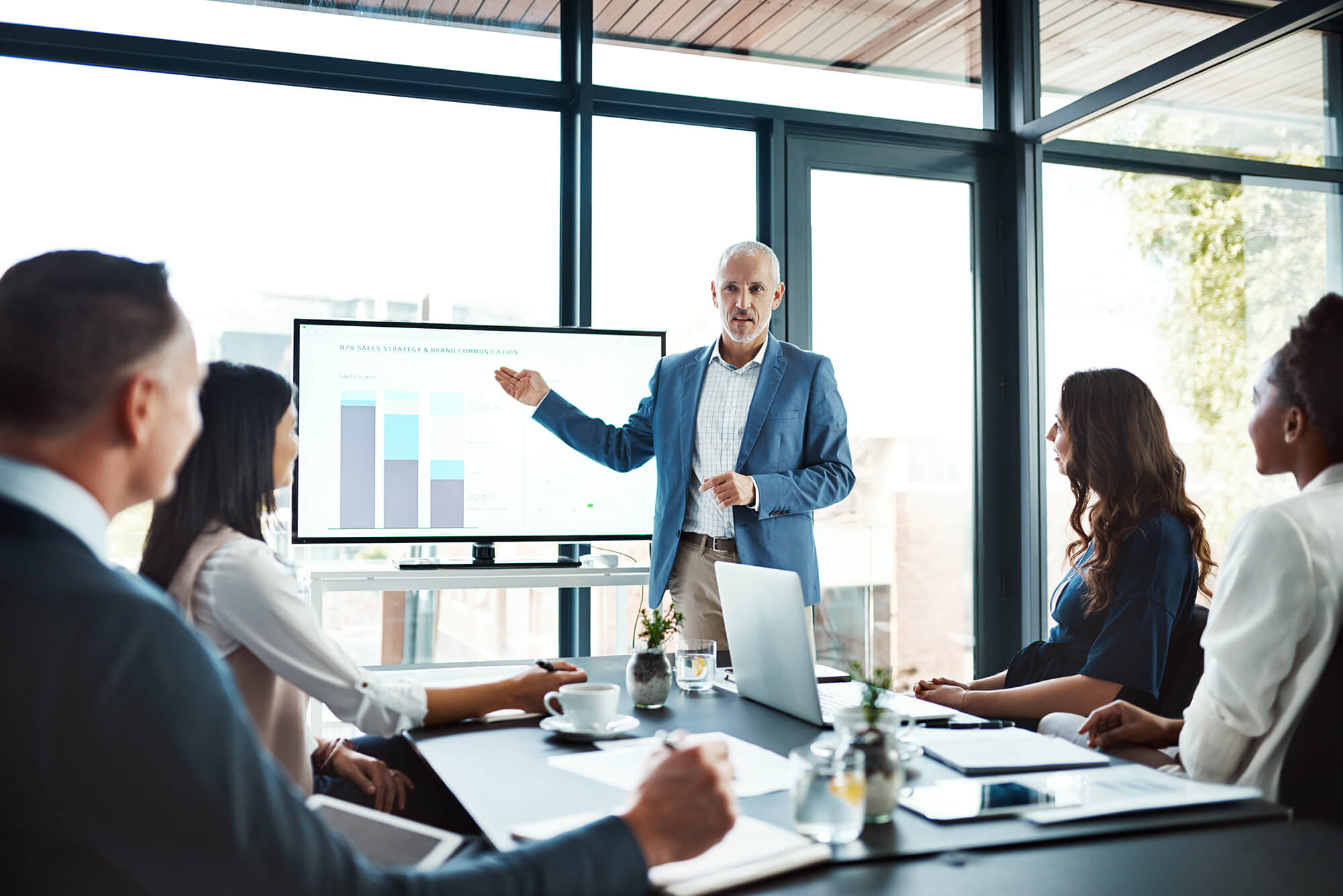 man presenting a business chart