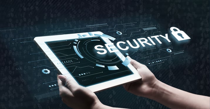 Hands holding an iPad with the word Security in large letters